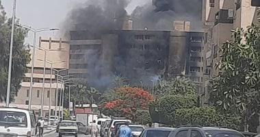 معاينة شقة للتحقيق في أسباب حريق أدى إلى إصابة شخصين بكرداسة